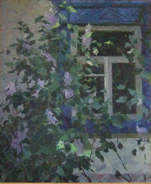 Lilac bush in front of the window of Isba (Ukraine)